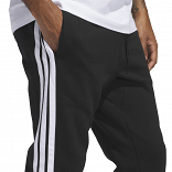 ESSENTIALS THREE STRIPES FLEECE PANTS